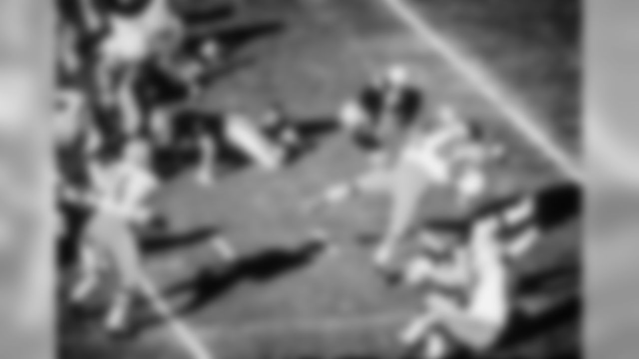Oakland's Hewritt Dixon (35) is upended trying to go over the line in the first period of the Super Bowl in Miami, Fla., Jan. 14, 1968. Green Bay defenders in white are Lionel Aldridge (82) and Ray Nitschke (66).