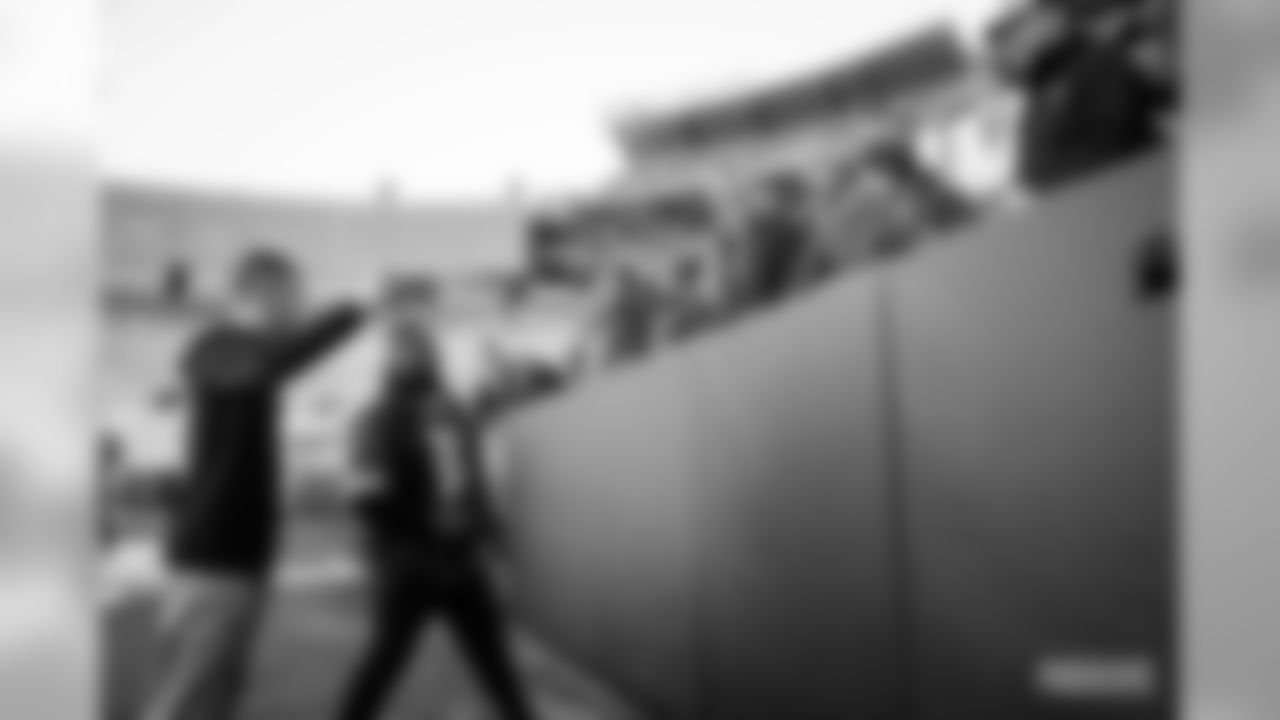 29 Packers fans attempt a Lambeau Leap at Lambeau Field on Saturday, Feb.29.