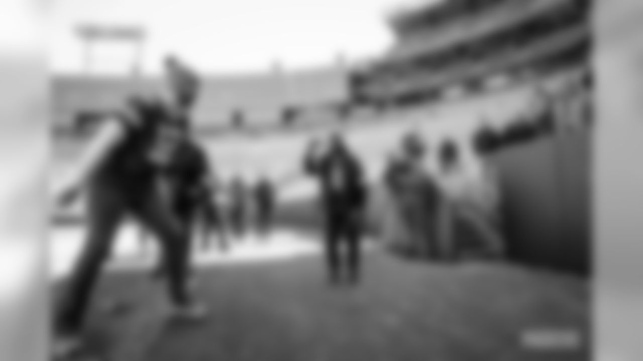 29 Packers fans attempt a Lambeau Leap at Lambeau Field on Saturday, Feb.29.