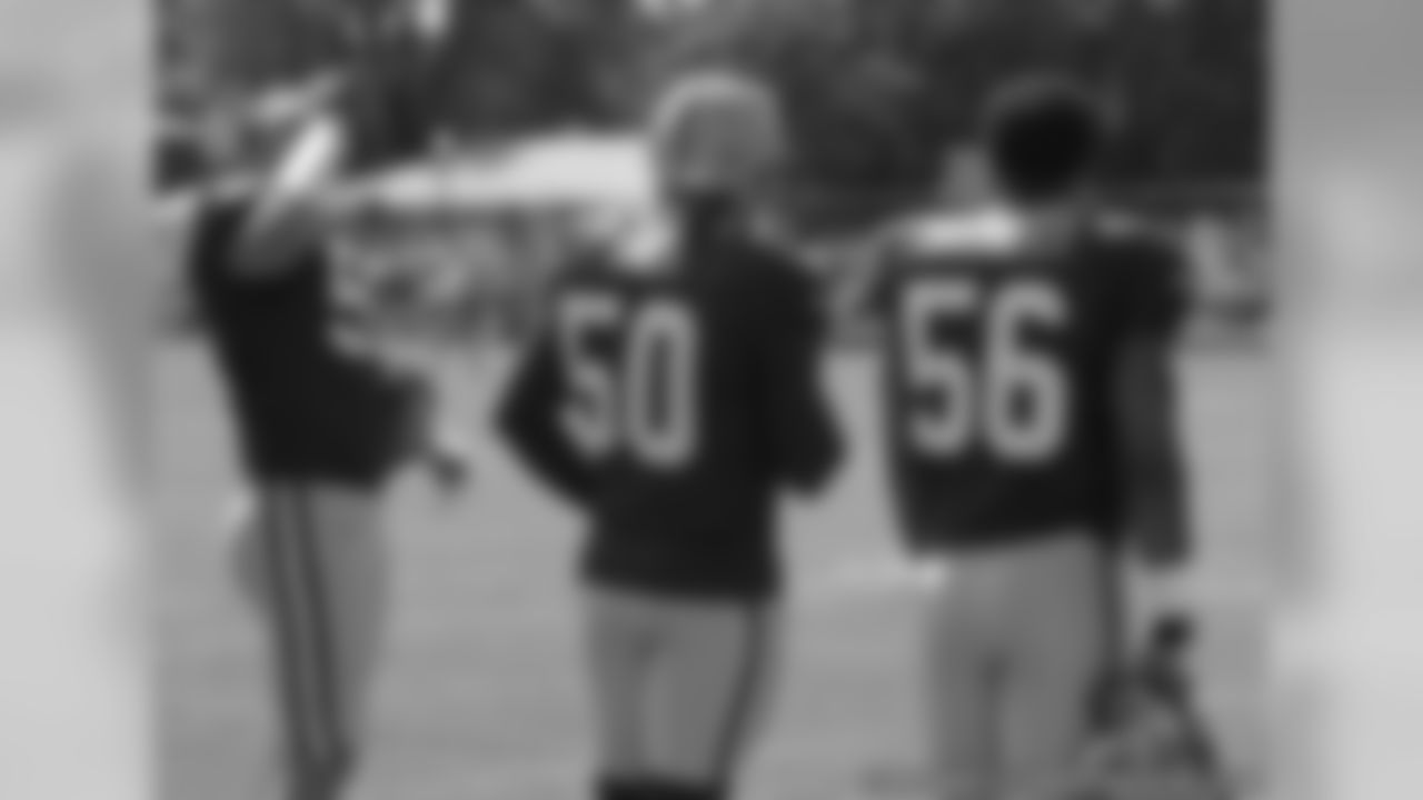 Brady Poppinga, A.J. Hawk and Nick Barnett