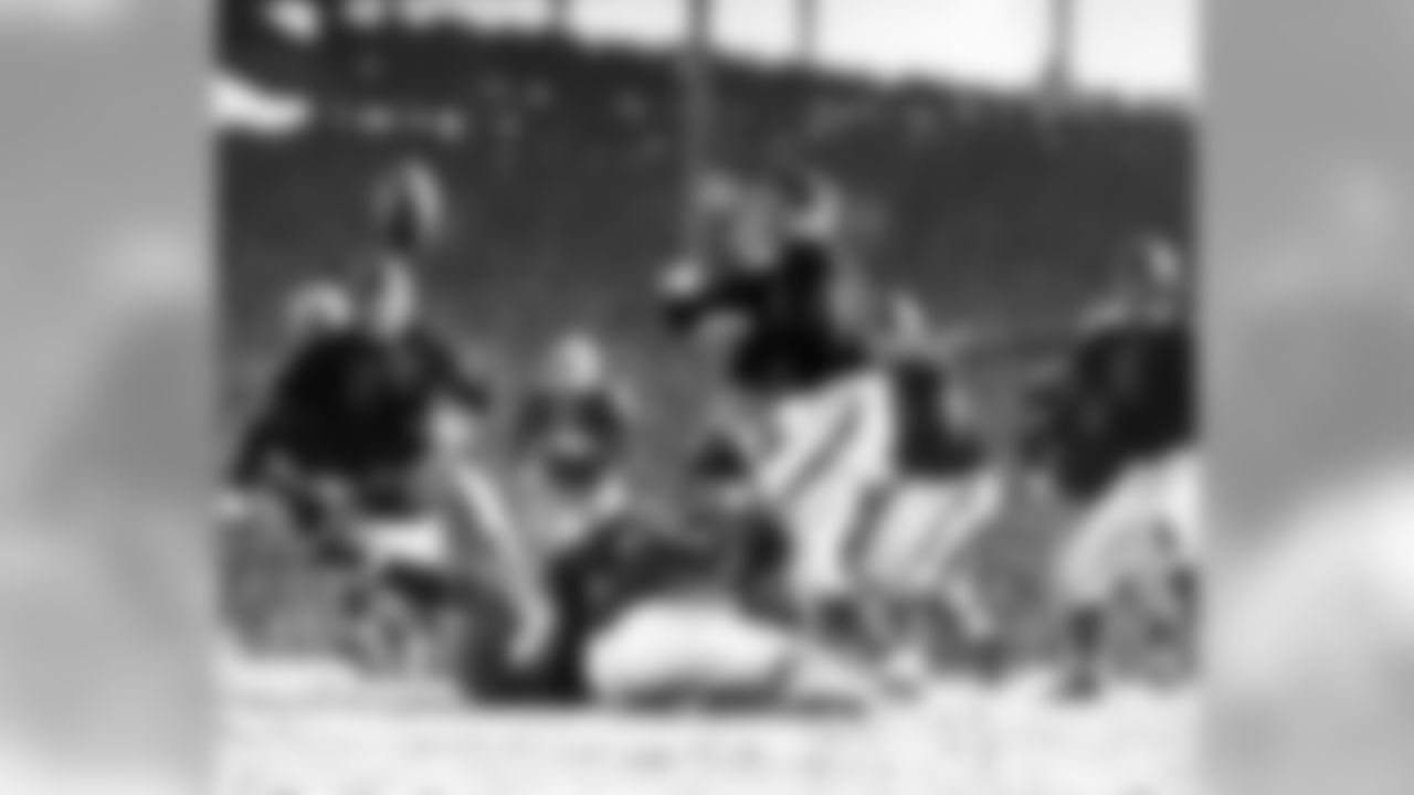 Dec. 14, 1941 - Bears Hall of Fame G Danny Fortmann (21) and Bears TE John Siegel (6) react to a loose ball during a 33-14 Packers loss to the Bears in the 1941 Western Division playoff game played at Wrigley Field in Chicago.