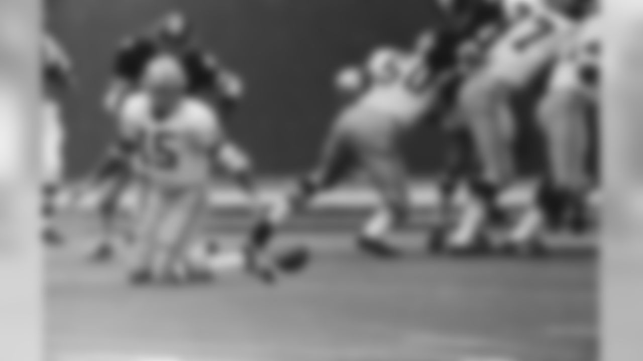 Dec. 7, 1970 - QB Bart Starr (15), then a 37 year-old, 10 year veteran, threw two second-half TD passes and brought his team from behind to defeat the Steelers. This play was a fumbled snap on the extra point after the first Packers touchdown in Pittsburgh. Rushing Starr is Steelers CB Mel Blount (47).