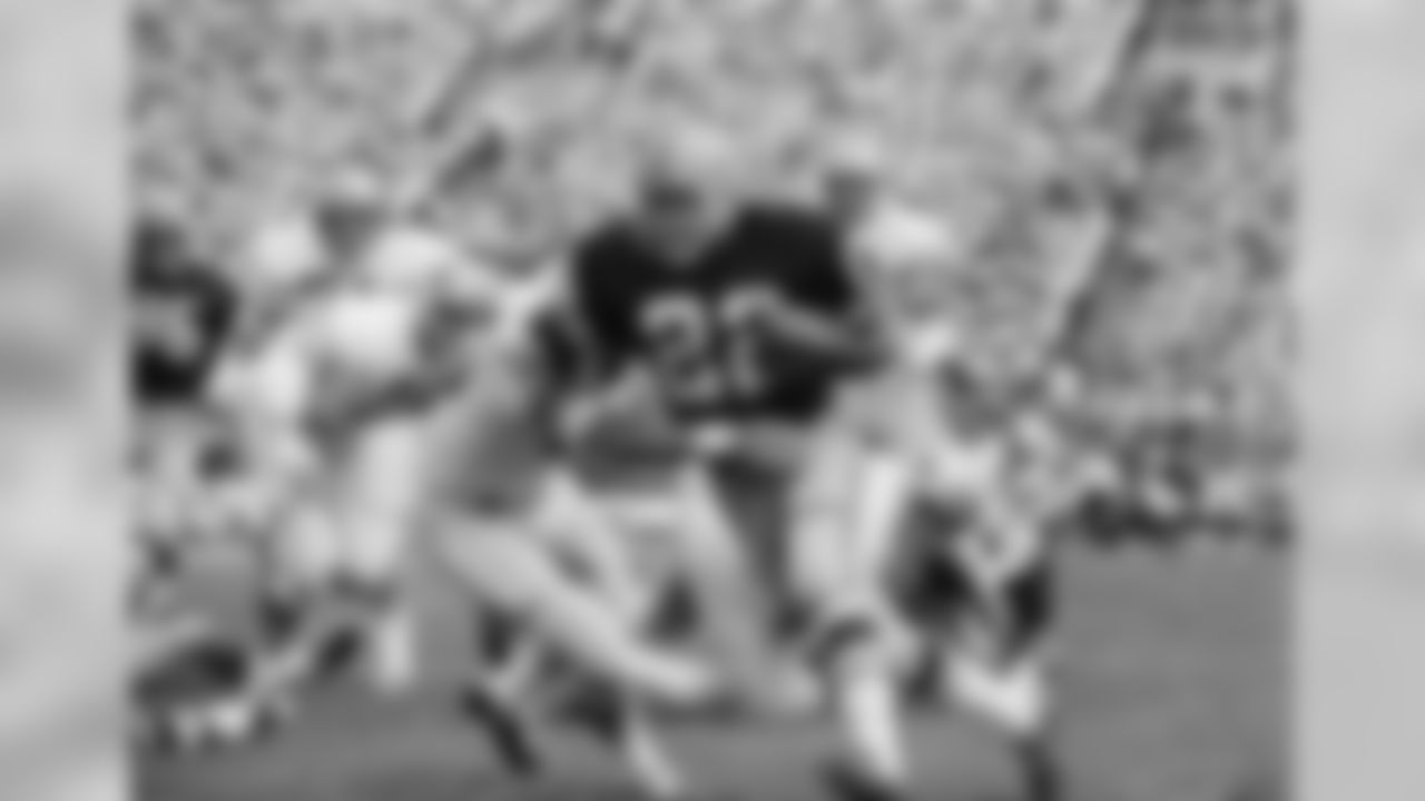 Sept. 18, 1967 - RB Elijah Pitts (22) runs to daylight as Wayne Walker (55) of the Lions tries to make the tackle during the Packers season opener. Pitts was the high scorer with two touchdowns, but Green Bay settled for a 17-17 tie. WR Boyd Dowler (86) is pictured in the back left of the photo. The Packers went on to win Super Bowl II later that year.
