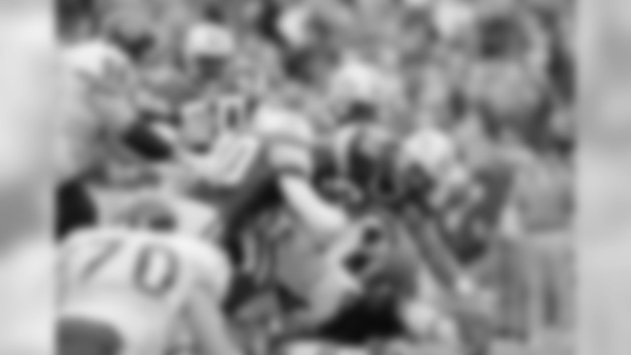 Oct. 31, 1993 - DE Reggie White (92), LB Tony Bennett (90), S LeRoy Butler (36), and LB Johnny Holland (50) go after a fumble by QB Jim Harbaugh (4) in the fourth quarter, helping the Packers to a 17-3 victory.