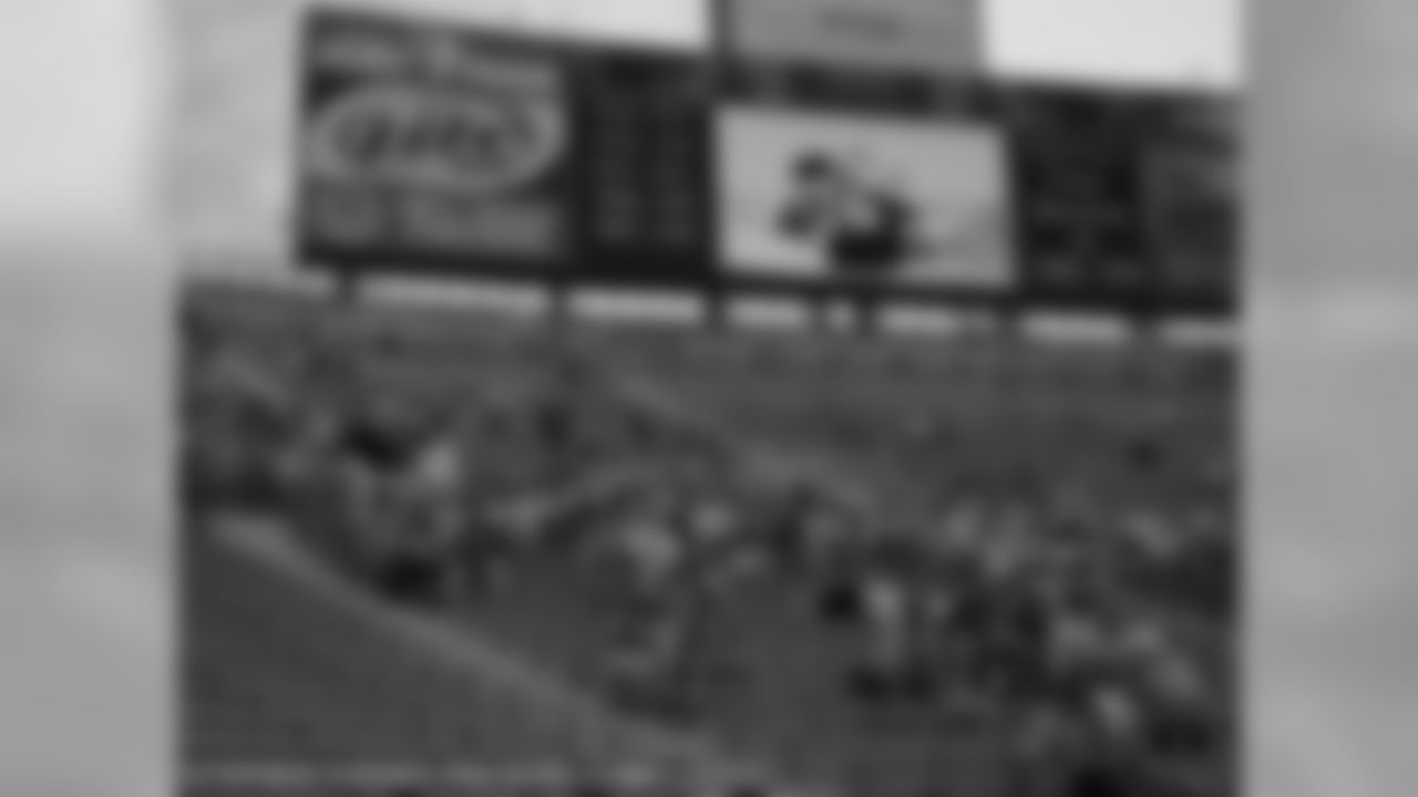 Shareholders wait to hear their individual section called for a tour of the Lambeau Field facilities.