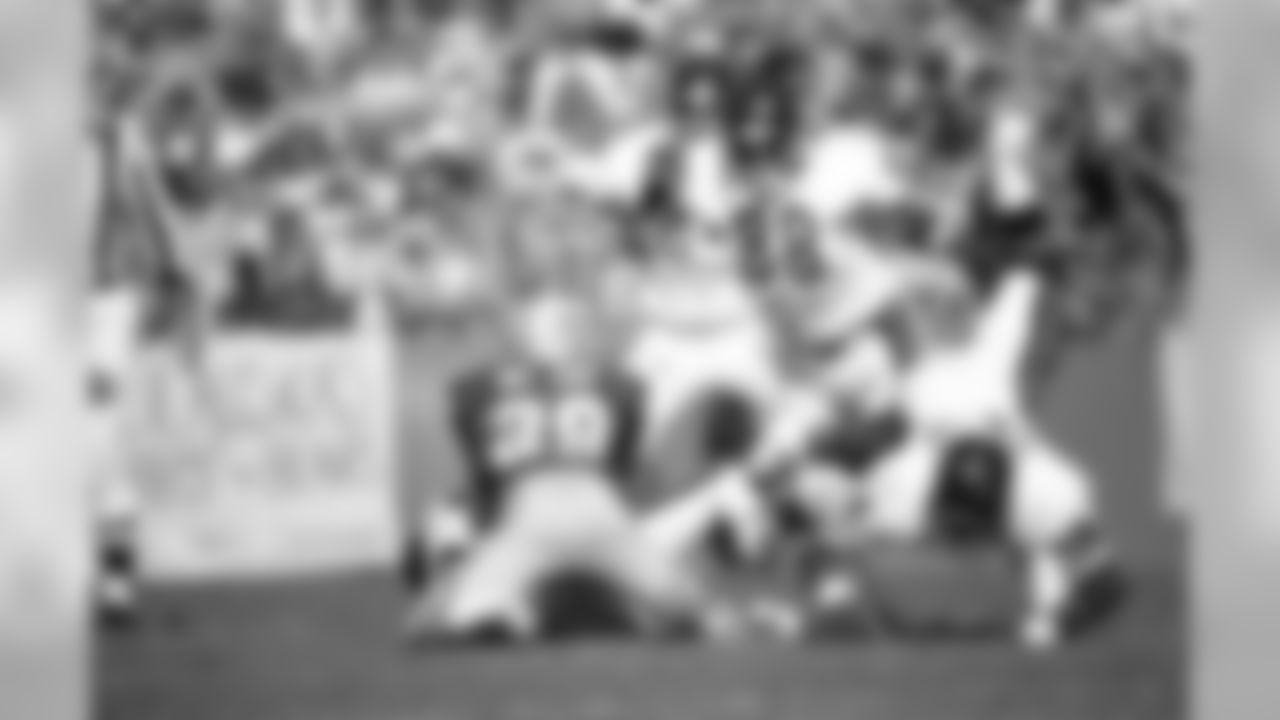 Oct. 8, 1978 - RB Walter Payton dives on the ball and recovers DB Mike McCoy's fumble during the second quarter. McCoy had intercepted a Bob Avellini pass but gave up the ball on the runback. The Packers won, 24-14, with 56,267 fans in attendance.