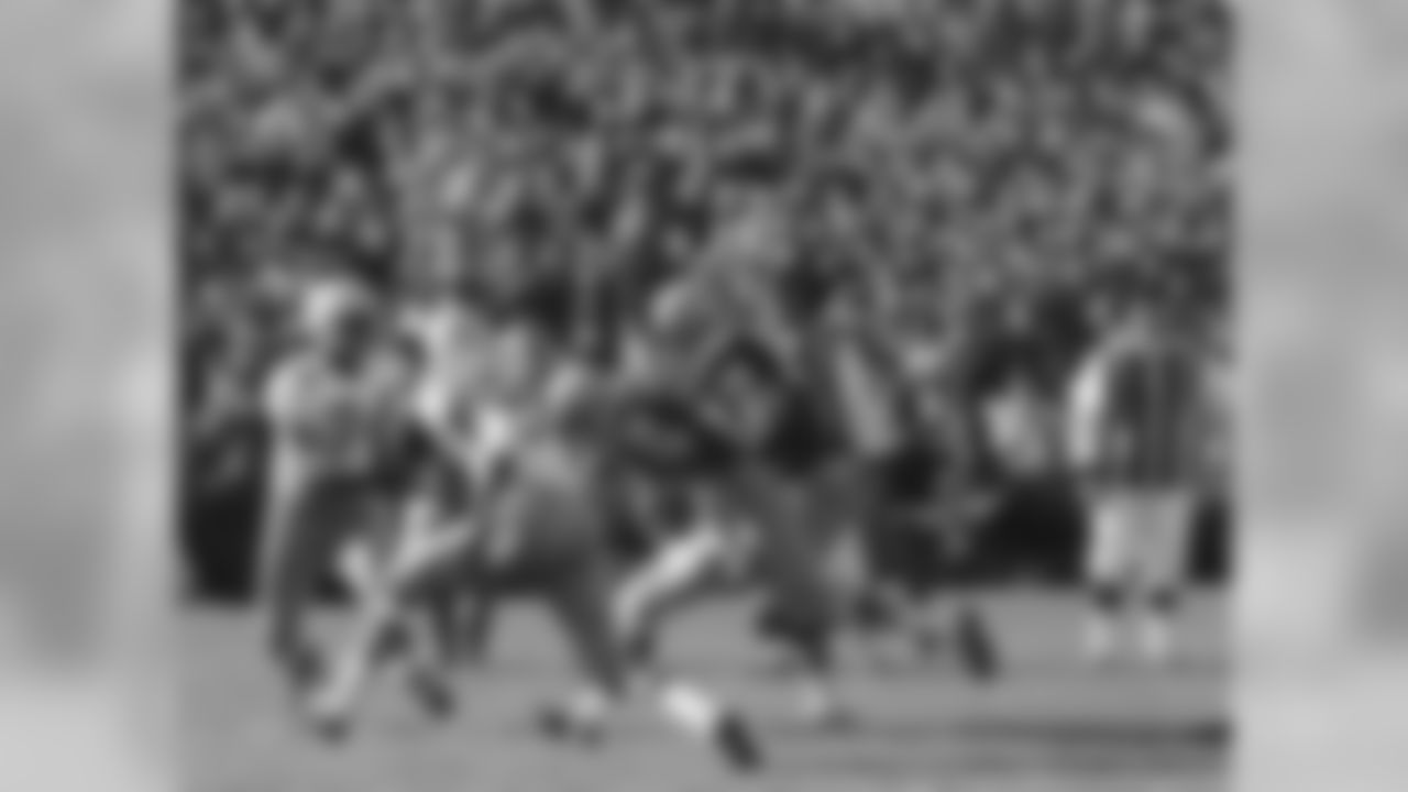 Oct. 24, 1965 - FB Jim Taylor (31) follows his blocker, G Jerry Kramer, (64) as he runs seven yards for the Packers' only touchdown against the Cowboys at Milwaukee County Stadium. The Packers beat the Cowboys, 13-3.