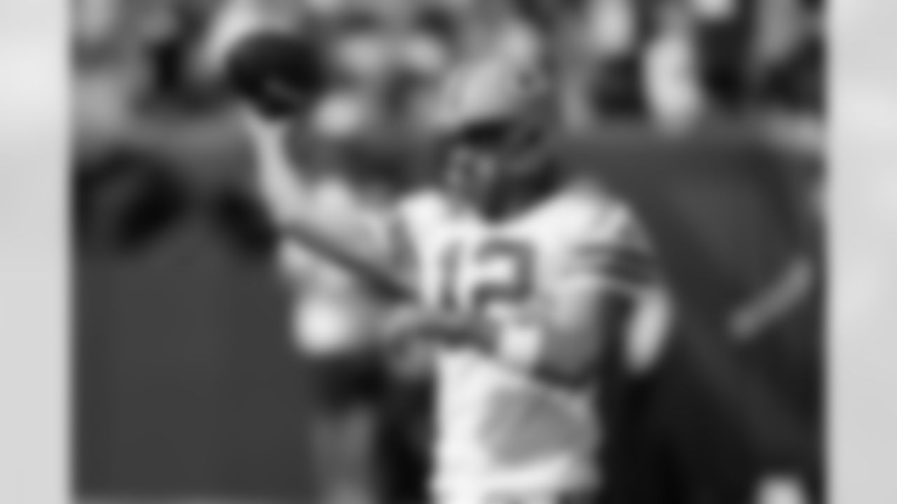 Green Bay Packers quarterback Aaron Rodgers (12) throws before an NFL football game against the Cincinnati Bengals in Cincinnati, Sunday, Oct. 10, 2021. (AP Photo/Bryan Woolston)