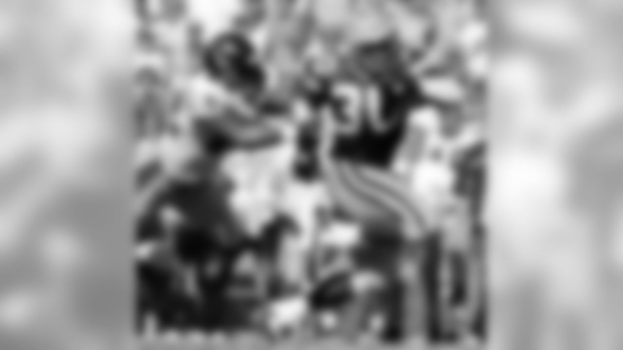 Sept. 8, 2002 - RB Ahman Green breaks away from Falcons S Gerald McBurrows for a 13-yard gain to set up the game-winning field goal at Lambeau Field. The Packers won, 37-34, in overtime. The Packers are currently on a four-game winning streak. Green Bay has posted at least one winning streak of four or more games each of the past six seasons (2009-14), the only NFL team to accomplish that feat over that span.