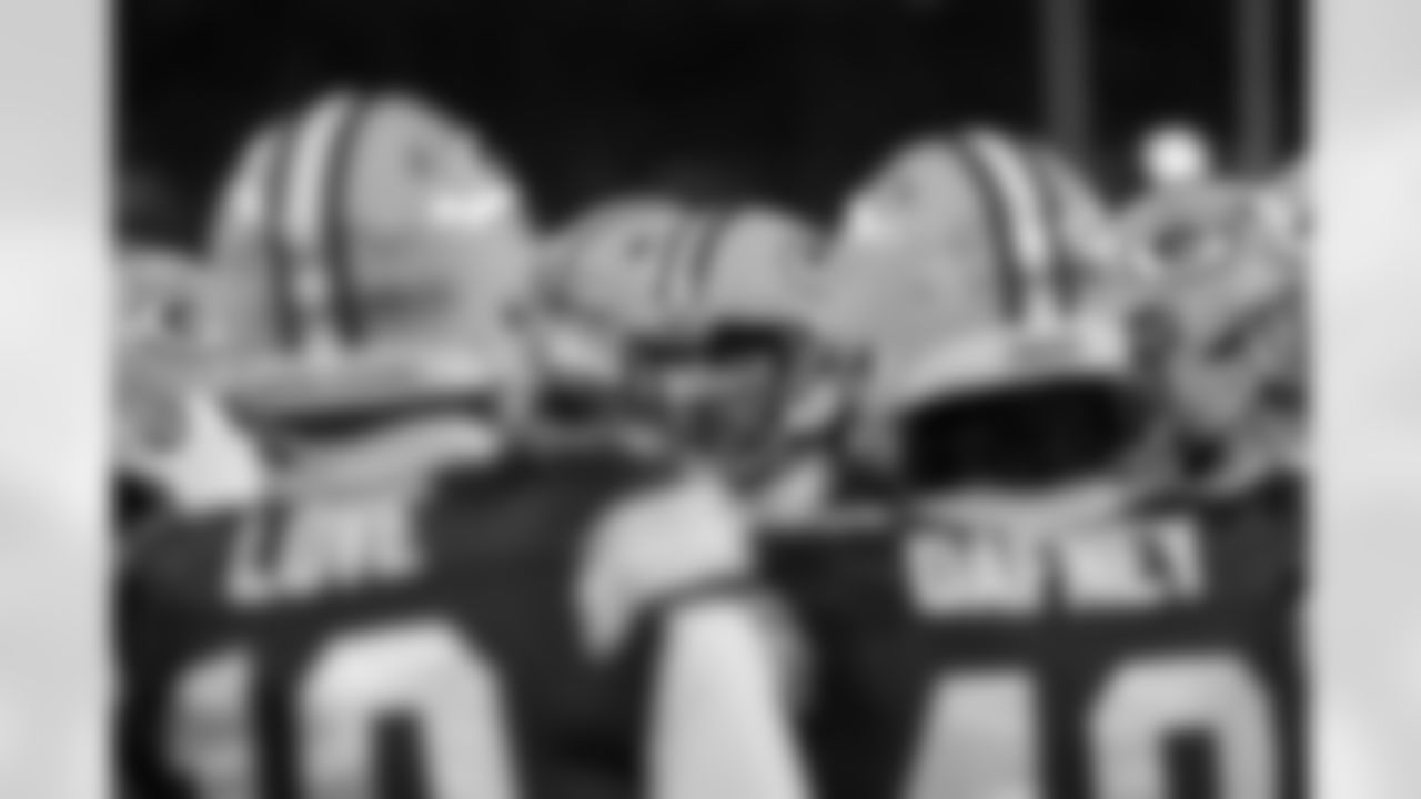 Green Bay Packers quarterback Aaron Rodgers (12) is seen in a huddle before an NFL Divisional Round playoff game against the San Francisco 49ers on Saturday, January 22, 2022 in Green Bay, Wisconsin. (Ryan Kang/NFL)