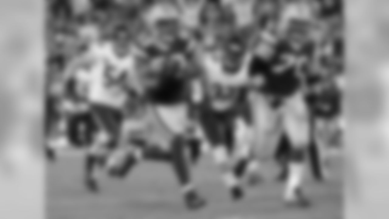TE Tom Crabtree, escorted by G T.J. Lang, takes off for a 27-yard TD on a fake field goal late in the second quarter that gave the Packers a 10-0 lead. The fake was called on fourth-and-26.
