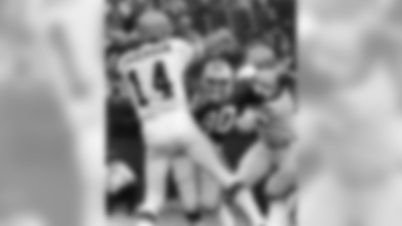 Packers DE Ezra Johnson (90) rushes forward as Bengals QB Ken Anderson (14) throws the ball. The game was played in Milwaukee, WI on October, 9 1977. Bengals won 17-7.