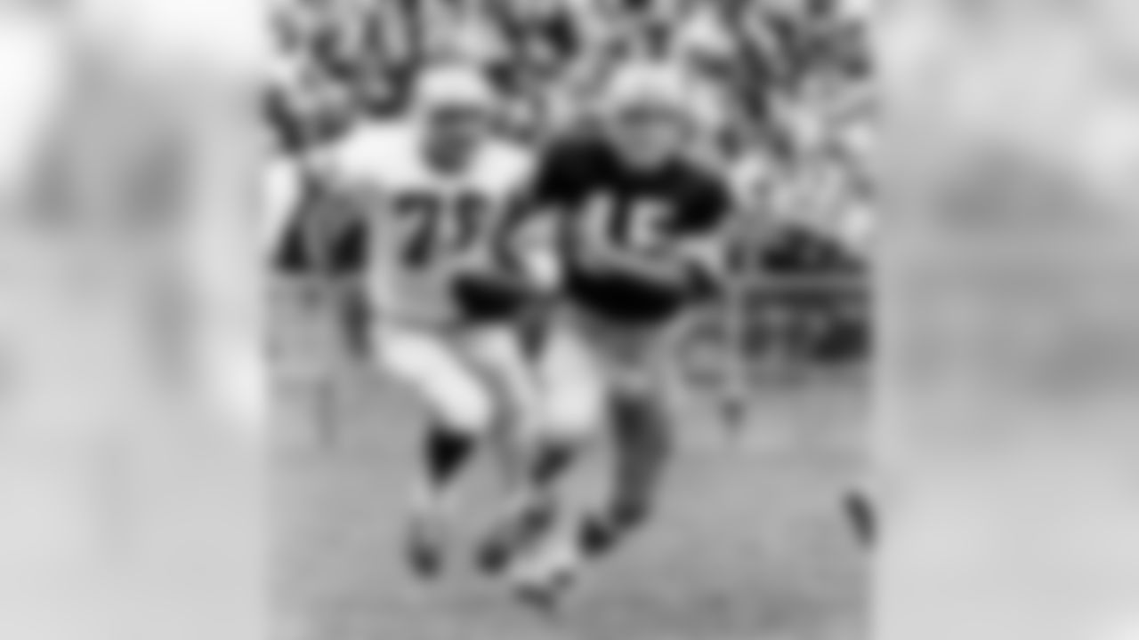 Oct. 2, 1966 - QB Bart Starr (15) runs for a first down. Chasing him is DE Darris McCord (78) of the Lions. The Packers won, 23-14, swept the Lions in the series, and went on to win Super Bowl I against the Kansas City Chiefs.