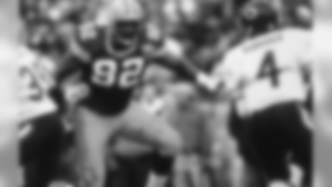 Oct. 31, 1993 - DE Reggie White is on his way to grab his second sack of the game on QB Jim Harbaugh. The Packers won, 17-3, with 58,945 in attendance. White led the team in sacks that year with 13.