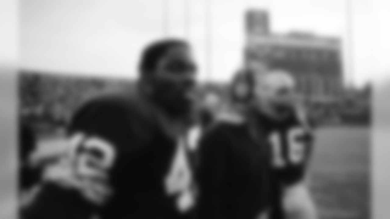 Nov. 5, 1972 - RB John Brockington (42) and QB Scott Hunter (16) watch from the sidelines next to Coach Bart Starr during the 34-24 Packers win in Milwaukee.