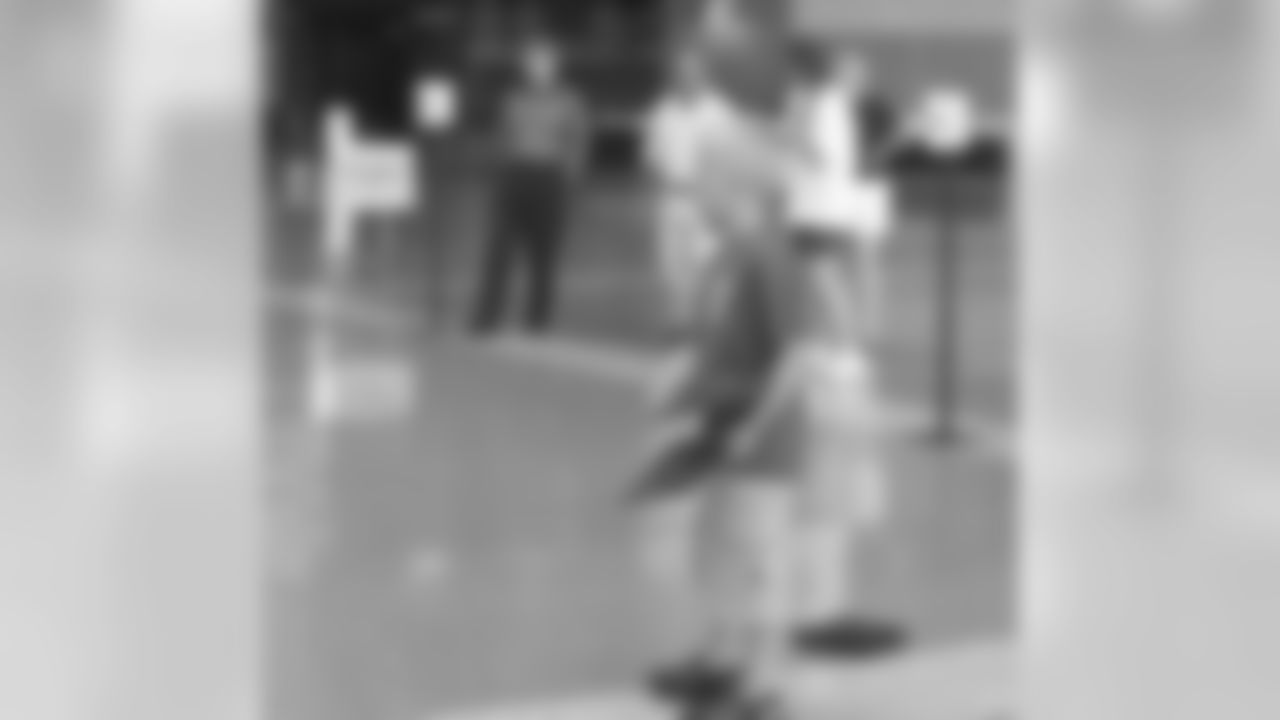 Cap Tossing Contest Held At Lambeau Field