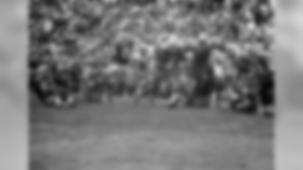 Oct. 7, 1962 - Halfback Paul Hornung (5) looks for a lane to run as QB Bart Starr (15) and G Fuzzy Thurston (63) watch. Hornung helped set up the game-winning field goal in the final period of the of the 9-7 win. Behind Hornung is Wayne Walker (55). Center is Roger Brown (76) and right is Darris McCord (78).