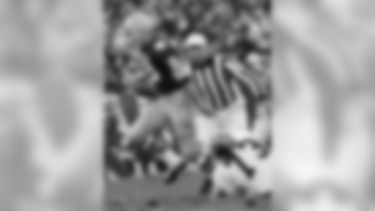 Oct. 26, 1969 - QB Bart Starr breaks a tackle from Falcons DT Dave Cahill during a game at Lambeau Field. The Packers won, 28-10.