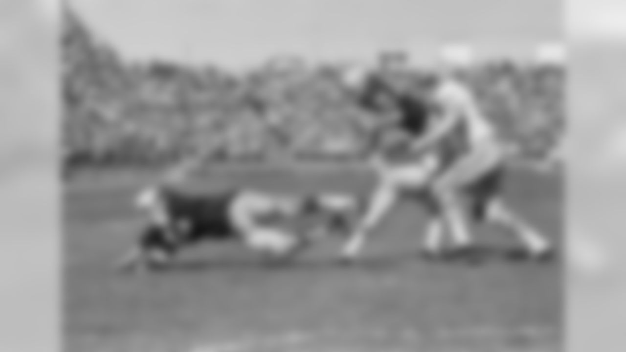 Sept. 30, 1968 - Gale Gillingham (68) throws a diving block for RB Donny Anderson (44) as he is swept off his feet by Lions cornerback Lem Barney (21) and linebacker Bill Swain (51). The Lions came back after an early Packers lead to win, 23-17.