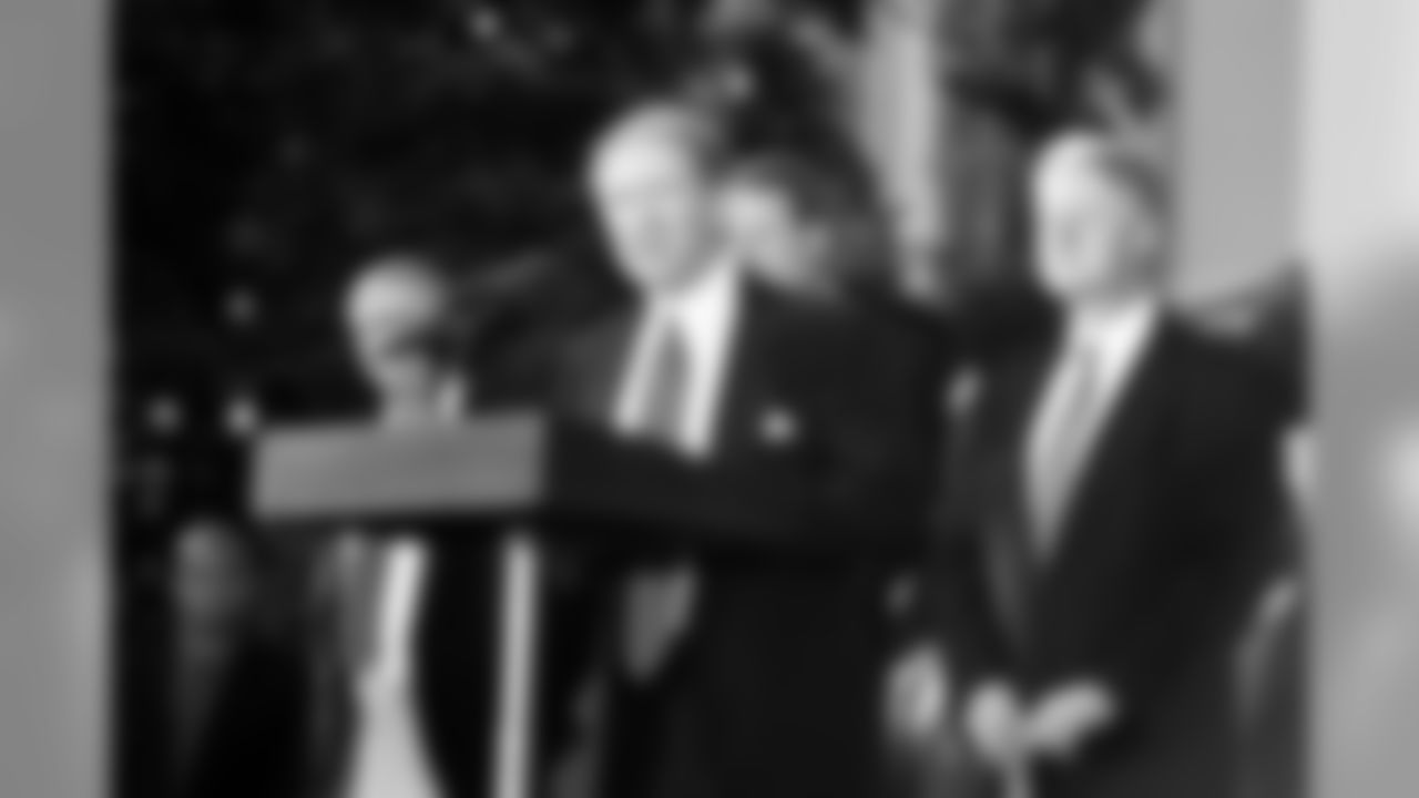 President/CEO Bob Harlan with Bill Clinton in the background