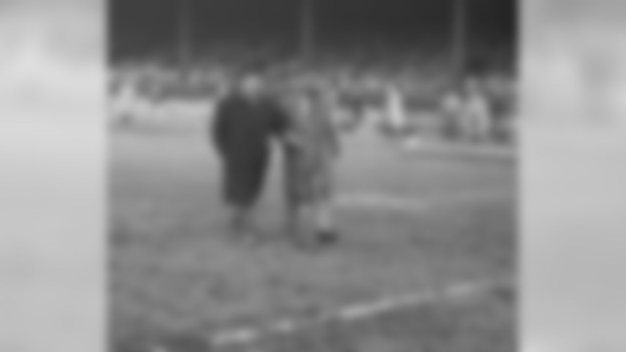 Nov. 26, 1953 - Packers Head Coach Gene Ronzani (left) and assistant coach Hugh Devore are shown walking across the field during halftime at Briggs Stadium in Detroit on Nov. 26, 1953.