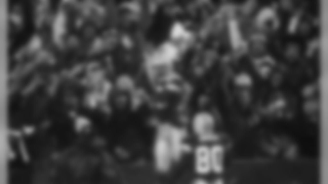 Nov. 6, 2000 - WR Antonio Freeman celebrates in the stands after making the game-winning touchdown catch in overtime to beat the Vikings, 26-20, in Green Bay on Monday Night Football.