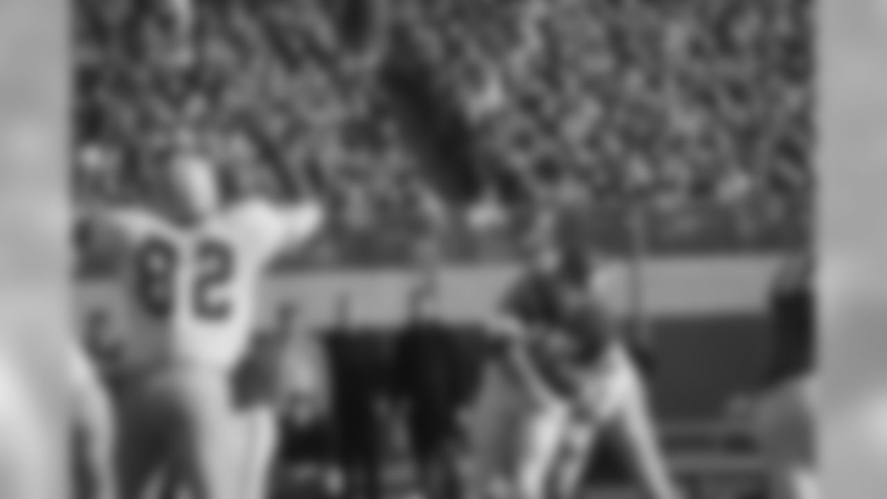 Nov. 21, 1965 - QB Fran Tarkenton (10) throws an incomplete pass as DE Lionel Aldridge (82) holds his hands in the air to obstruct his view. The Packers won, 38-13.