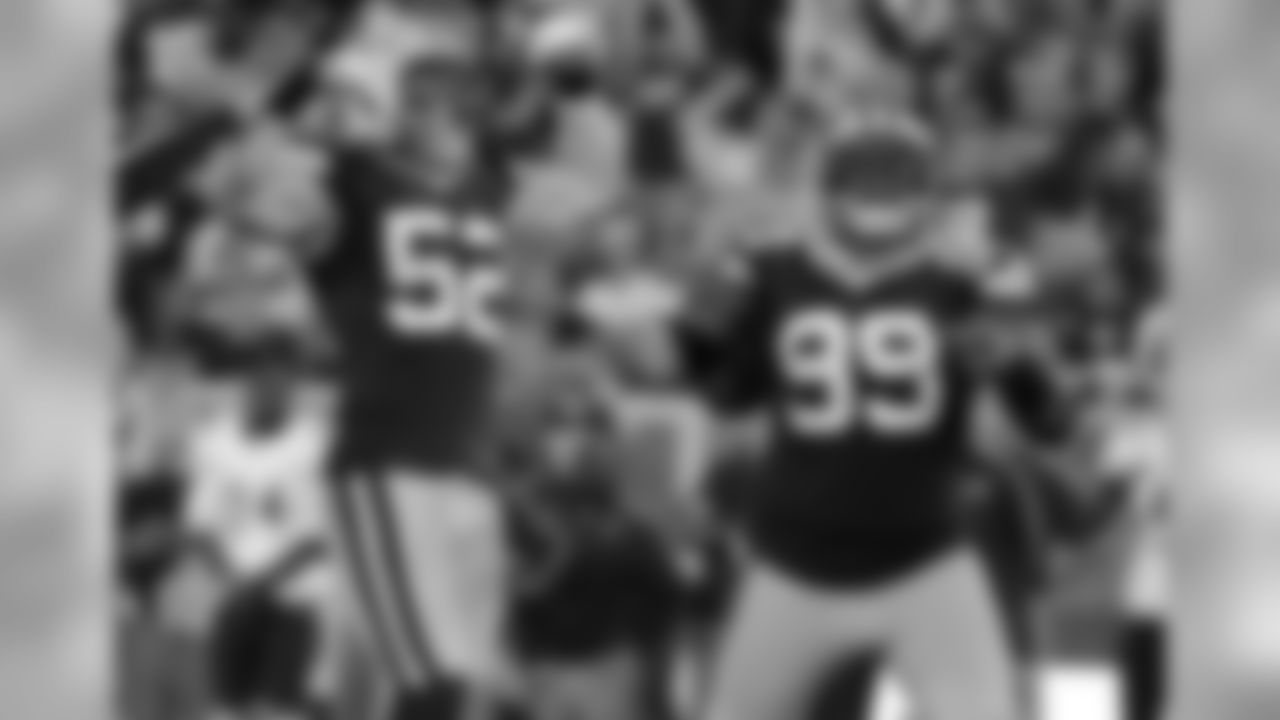 LB Clay Matthews and DE Jerel Worthy celebrate one of the Packers' seven sacks. Matthews had 3.5 sacks and Worthy had the first of his career.