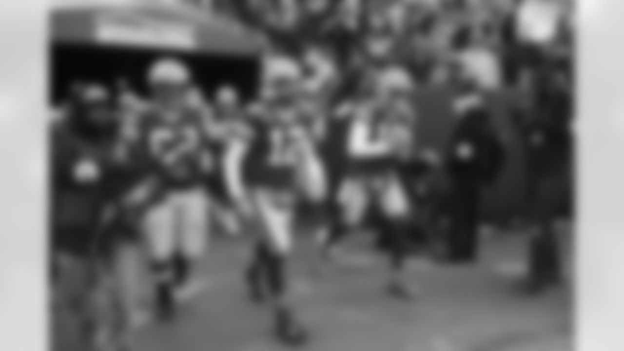 Green Bay Packers quarterback Aaron Rodgers (12) walks out before an NFL football game against the Cleveland Browns on Saturday, December 25, 2021 in Green Bay, Wisconsin. (Todd Rosenberg/NFL)