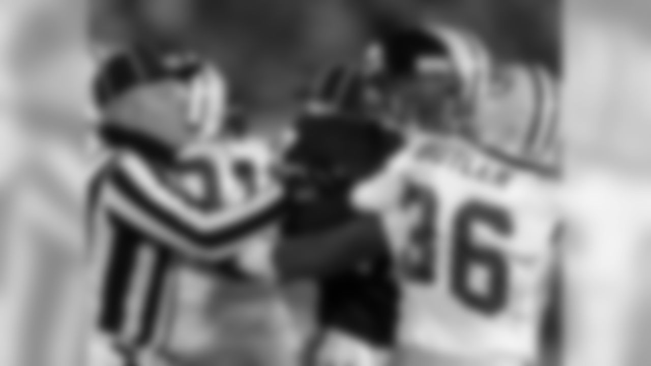 Dec. 3, 2000 - An official breaks up a scuffle between the Bears' Ray McElroy and Packers S LeRoy Butler during the third quarter in Chicago, Dec. 3, 2000. The Packers won, 28-6.