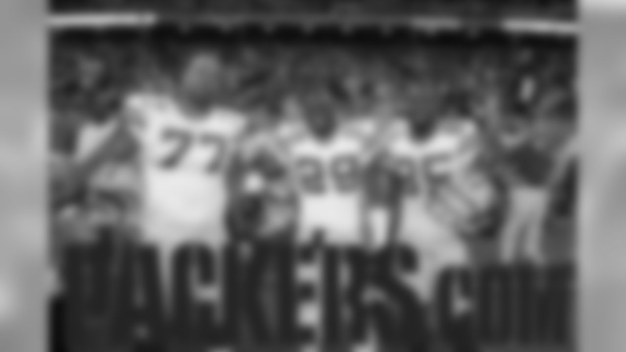Nov. 26, 2009 -Captains DE Cullen Jenkins (77), S Derrick Martin, and WR Greg Jennings (85) pose for a photo at Ford Field.