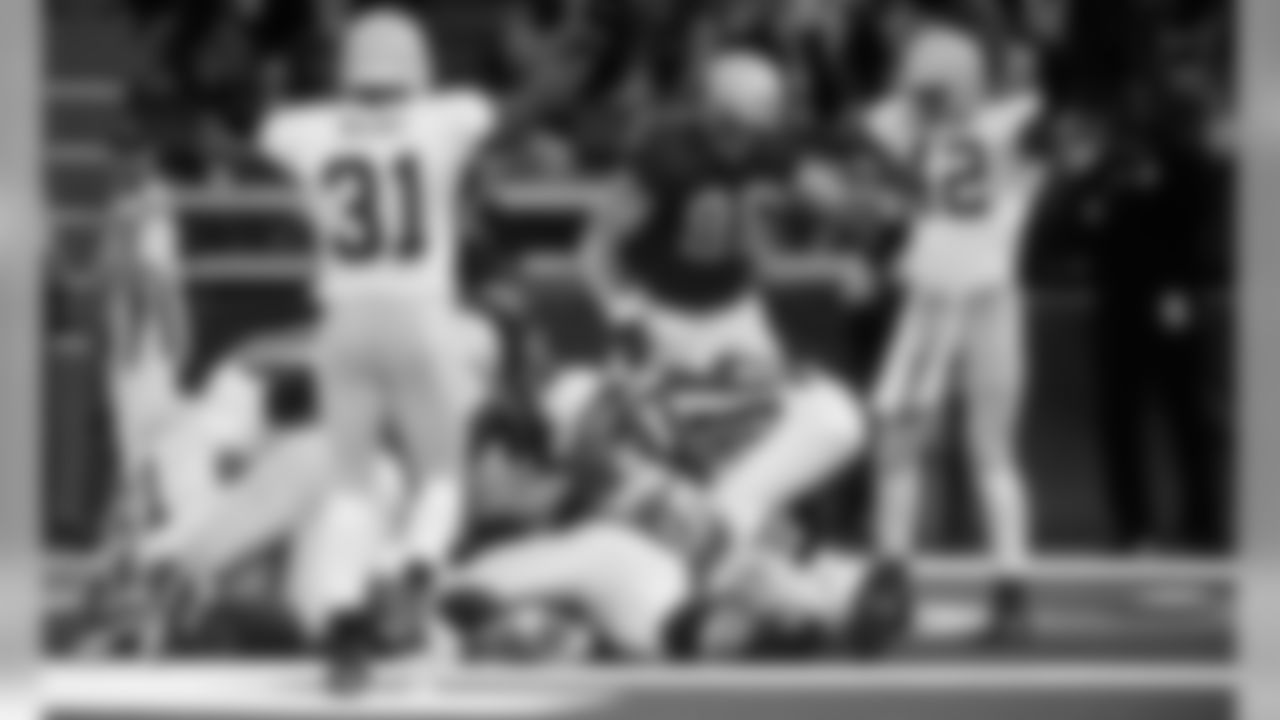 Nov. 22, 2001 – The Packers defense sacks QB Charlie Batch in the end zone for a safety. Kabeer Gbaja-Biamila was responsible for the sack, while finishing 2001 with 13.5.
