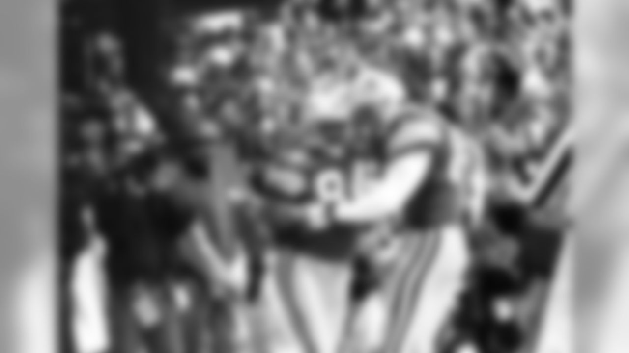 Nov. 24, 1994 - WR Sterling Sharpe (84) is congratulated by teammate Mark Chmura (89) after a third-quarter touchdown against the Cowboys in Irving, Texas, Thanksgiving Day, 1994. Sharpe scored four touchdowns in the game but the Packers lost to the Cowboys, 42-31.