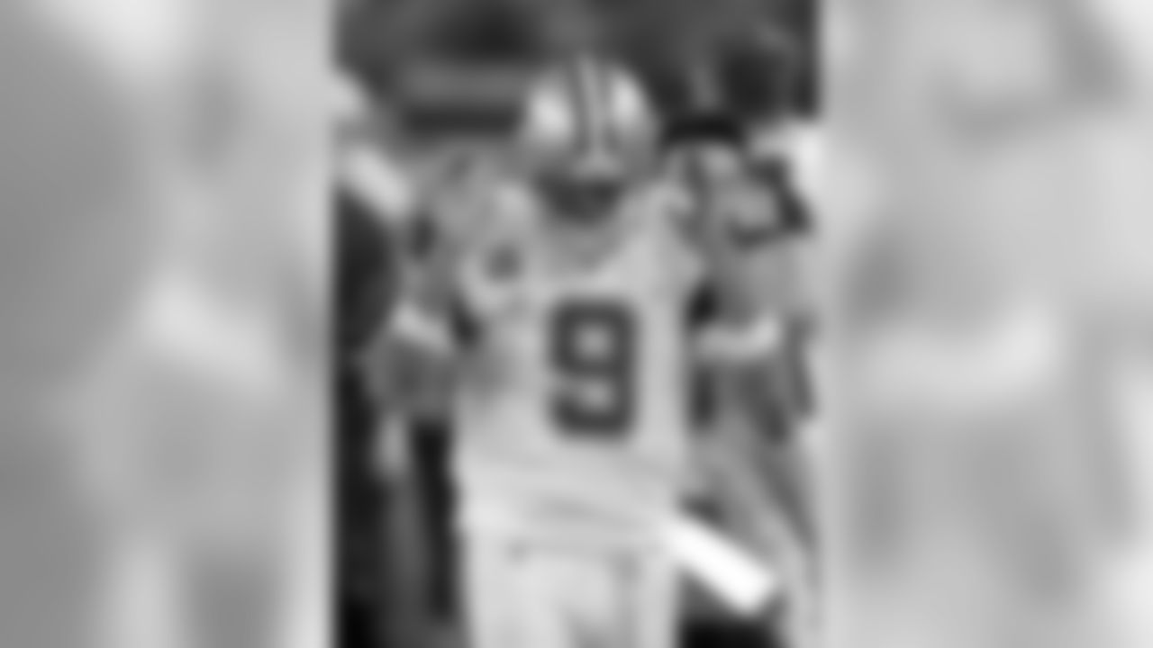 Dallas Cowboys quarterback Tony Romo walks back to the sideline after throwing his third interception of the first half of an NFL football game against the Carolina Panthers, Thursday, Nov. 26, 2015, in Arlington, Texas. (AP Photo/Brandon Wade)