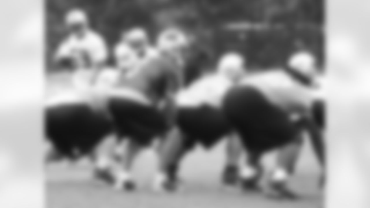 Matt Moore looks over the defense as he prepares for Mackenzy Bernadeau to snap him the football; June 16, 2009 at OTAs.