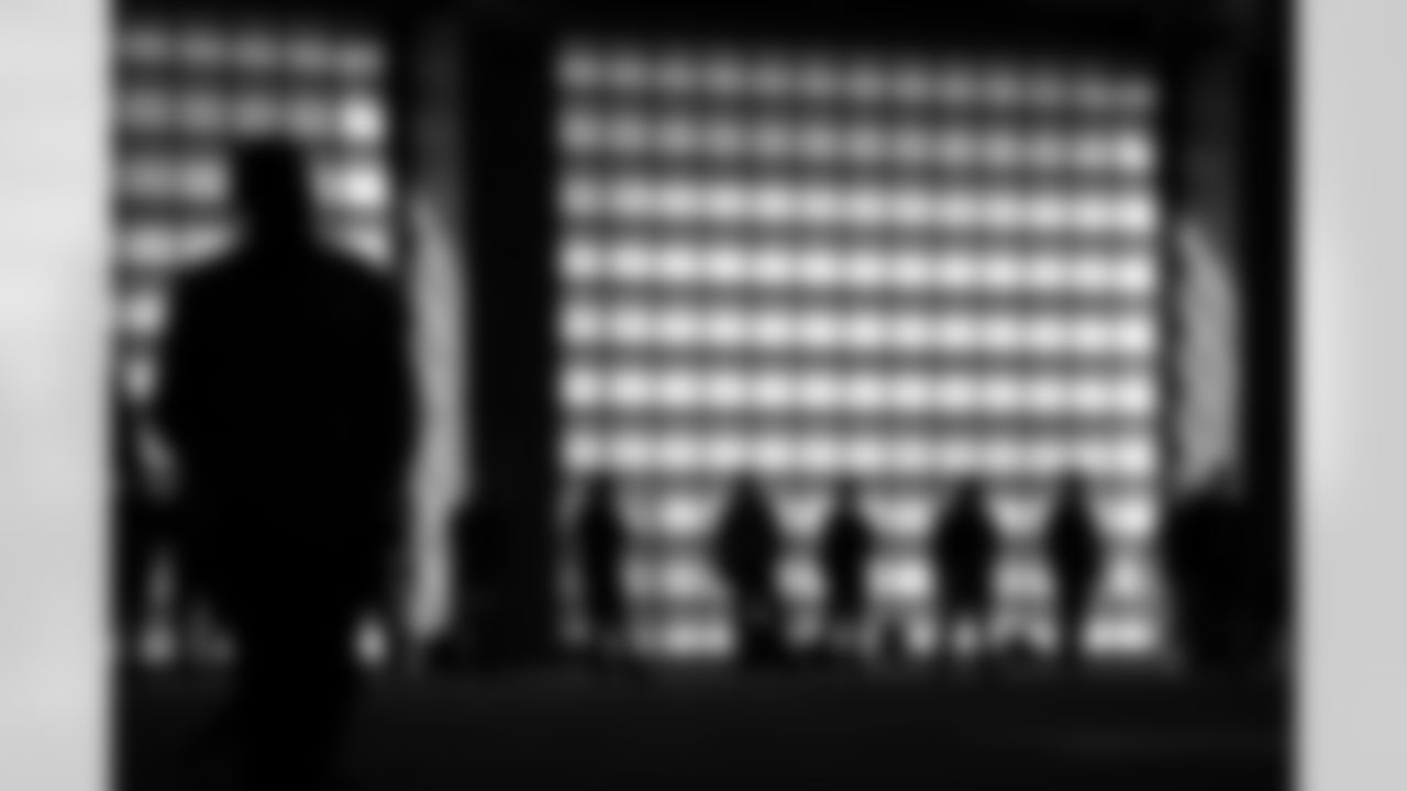 Scouts watch North Carolina players during the school's Pro Day football workout for NFL scouts in Chapel Hill, N.C., Monday, March 29, 2021. (AP Photo/Gerry Broome)