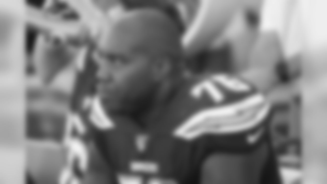 Los Angeles Chargers offensive tackle Russell Okung (76) looks on from the sideline bench during an NFL football game against the Green Bay Packers, Sunday, Nov. 3, 2019 in Carson, Calif. The Chargers defeated the Packers 26-11. (Paul Spinelli via AP)