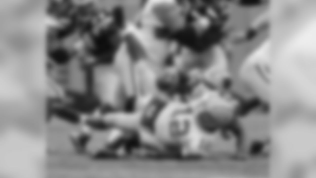 Green Bay Packers' Aaron Rodgers (12) is sacked by Carolina Panthers' Thomas Davis (58) in the first half of an NFL football game in Charlotte, N.C., Sunday, Nov. 8, 2015. (AP Photo/Mike McCarn)