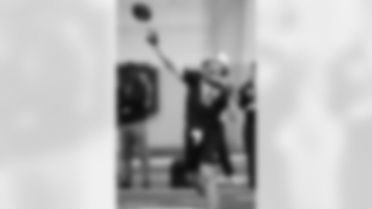 Quarterback Kenny Pickett (8) goes through passing drills during Pittsburgh's football pro day , Monday, March 21, 2022, in Pittsburgh. (AP Photo/Keith Srakocic)