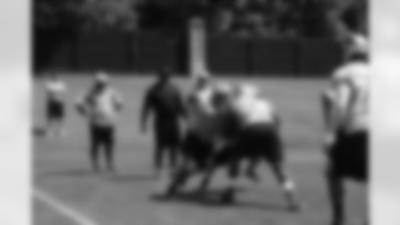 Offensive linemen complete a drill.