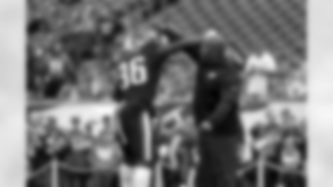 Philadelphia Eagles' Jay Ajayi, left, and coach Duce Staley react during warm-ups before an NFL football game against the Denver Broncos, Sunday, Nov. 5, 2017, in Philadelphia. (AP Photo/Michael Perez)