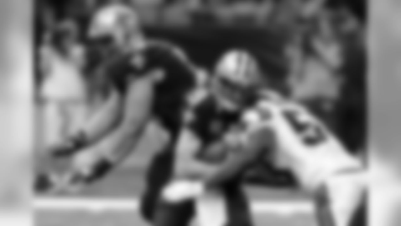 New Orleans Saints quarterback Drew Brees (9) is sacked by Carolina Panthers outside linebacker Thomas Davis in the second half of an NFL football game in New Orleans, Sunday, Dec. 6, 2015. (AP Photo/Jonathan Bachman)