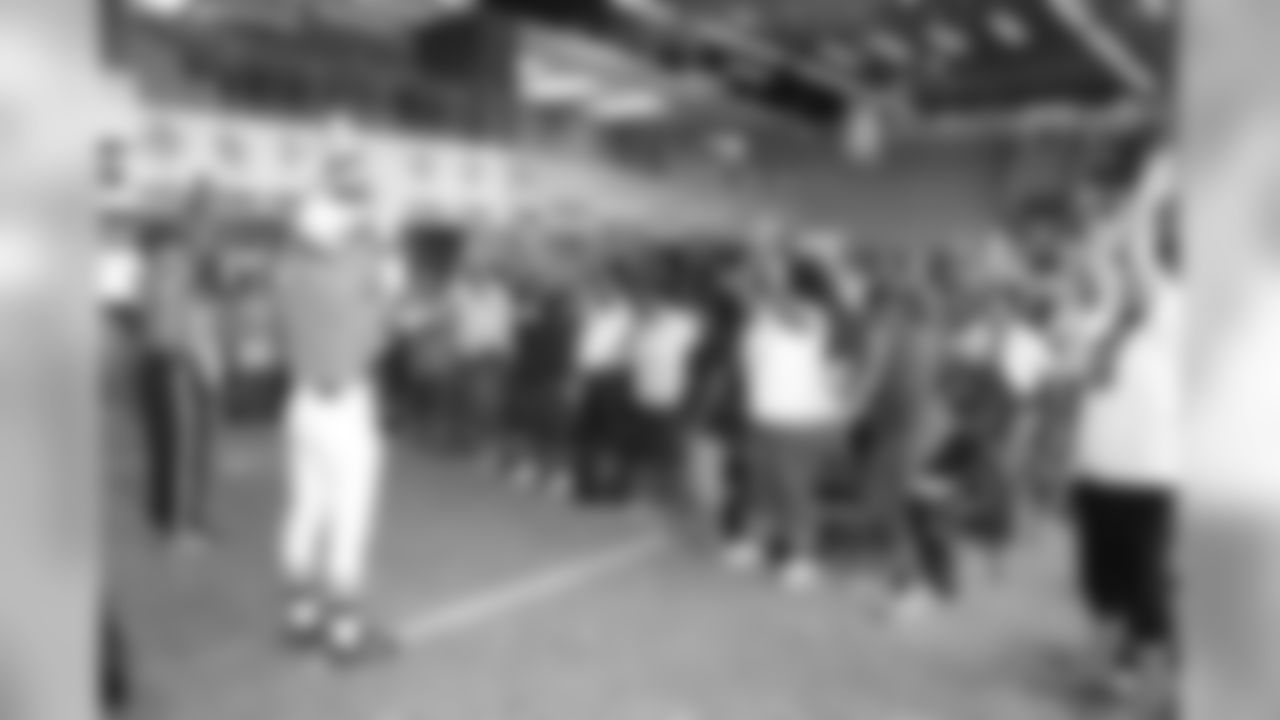 Referees Josh Fath and Karl Logan of RCB Sports, Inc., taught Moms the rules of the game, including downs, scoring, field features, game clock, penalties and signals.
