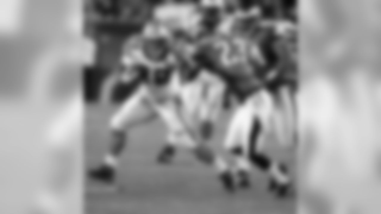 Stewart uses a stiff arm to break away against the Philadelphia Eagles.