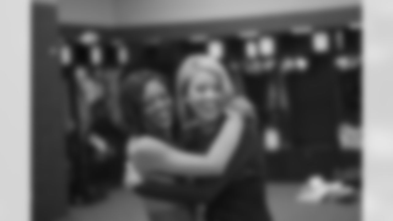 Shannon and Annalise hug each other in between photo sessions