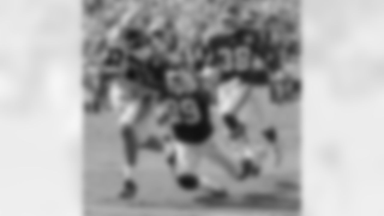 Carolina Panthers' Muhsin Muhammad (87) drags Kansas City Chiefs' Brandon Carr (39) while crossing the goal line for a touchdown in the third quarter of the Panthers' 34-0 win in an NFL football game in Charlotte, N.C., Sunday, Oct. 5, 2008. Kansas City Chiefs' DaJuan Morgan (38) pursues. (AP Photo/Chuck Burton)