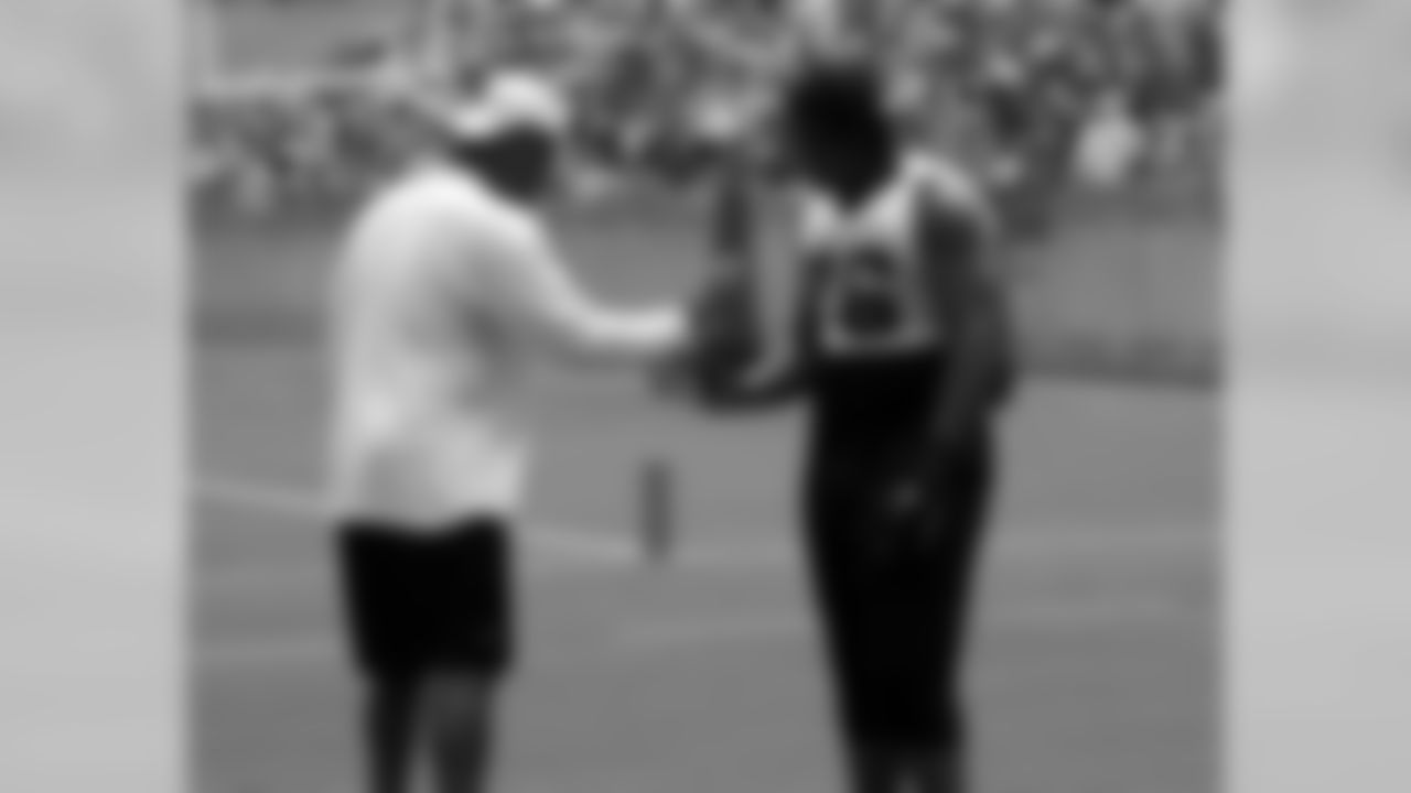 Defensive line coach Eric Washington and DE Greg Hardy