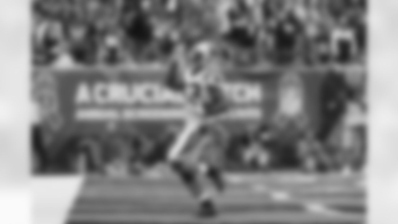 Carolina Panthers running back Fozzy Whittaker scores on a four yard run in the second half of an NFL football game against the Cincinnati Bengals, Sunday, Oct. 12, 2014, in Cincinnati. (AP Photo/Paul Sancya)