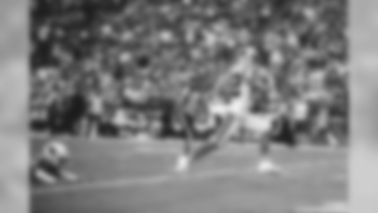 I was about 30 yards down the field shooting with my 400mm when Christian McCaffrey broke free in Arizona. I quickly pulled my 135mm from my right side and fired off a few frames as he was passing me, which resulted in this sweet picture of Christian in full stride with a diving Cardinals defender halfway in the frame.