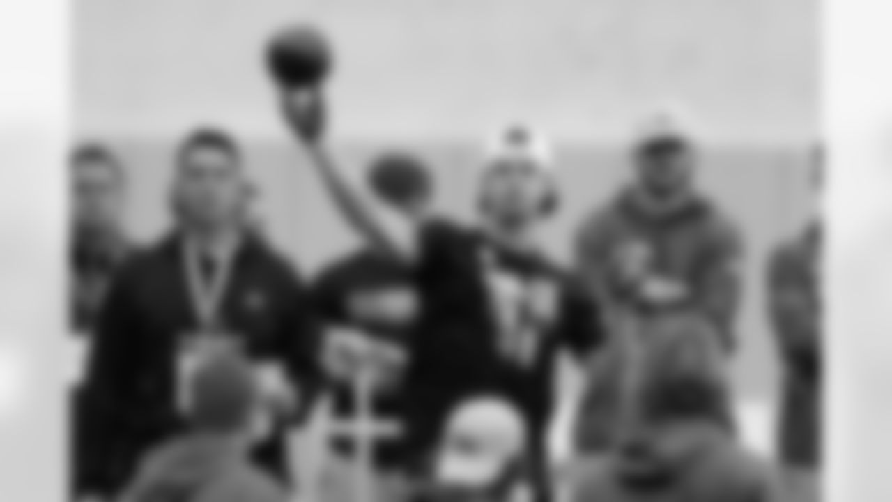 Quarterback Kenny Pickett (8) goes through passing drills during Pittsburgh's football pro day, Monday, March 21, 2022, in Pittsburgh. (AP Photo/Keith Srakocic)